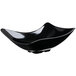 A black melamine bowl with a curved edge.