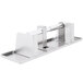 A stainless steel Bobrick multi roll toilet paper dispenser with a metal handle.