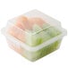 A clear plastic GET reusable container with food inside.