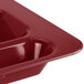 A red Cambro cranberry serving tray with 6 compartments.