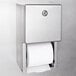 A stainless steel Bobrick multi roll toilet paper dispenser with a roll of toilet paper.