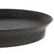 A black oval deli server made of polypropylene on a table in a salad bar.