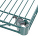 A close-up of a Metroseal 3 wire shelf with a green metal finish.