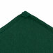 A hunter green fabric chef neckerchief with stitched edges.