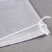 A clear Bobrick vinyl liner with a white string tied to it.