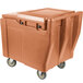 A Cambro Coffee Beige SlidingLid™ Mobile Ice Bin with wheels.