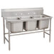 An Advance Tabco stainless steel three compartment pot sink on stainless steel legs.