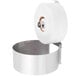 A Bobrick surface-mounted toilet paper holder with a roll of toilet paper on it.