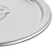 A close-up of a silver Vollrath stainless steel lid with a metal handle.
