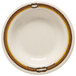 A white melamine bowl with a brown and yellow diamond design.