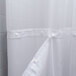 A white Oxford shower curtain with a sheer voile window and removable liner.