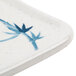 A white rectangular plate with a blue bamboo leaf design.