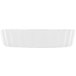 A white rectangular dish with a scalloped edge.