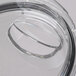 A clear lid with a circular hole for a Waring 2.5 qt. flat bowl.