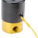 A black and yellow solenoid valve with a yellow wire.
