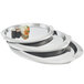 A stack of oval silver Vollrath serving trays with sushi on them.