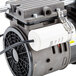 The ARY VacMaster 978377 oil free vacuum pump with a hose attached.