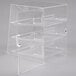 A clear acrylic Cal-Mil display case with three shelves.