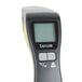 A Taylor digital infrared thermometer with a black background.