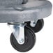 A gray plastic dolly wheel for a Continental Huskee white trash can.