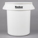 A white Continental Huskee 20 gallon trash can with lid and dolly.