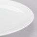 A close-up of a Homer Laughlin bright white china platter with a white rim.