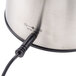 A stainless steel charging base with a cord attached to it for a Waring Electric Wine Opener.