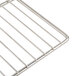 An Avantco stainless steel wire rack with a handle.