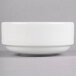 A Homer Laughlin Ameriwhite Alexa china bowl with a white rim on a gray surface.
