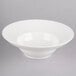 A white Homer Laughlin china bowl with a small rim on a white surface.
