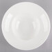 A white china bowl with a white rim.