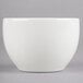 A Homer Laughlin bright white china bouillon bowl with a white rim on a grey surface.