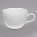 A white Homer Laughlin china cup with a handle.