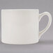A close-up of a Homer Laughlin Market Street ivory jumbo china mug with a handle.