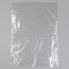 A clear plastic bag of 1/6 size steam table pan liners on a white surface.
