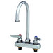 A silver T&S deck-mount workboard faucet with two handles.