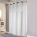 A white Hookless shower curtain with white striped border.