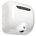 A white Excel hand dryer with black XLERATOR text.