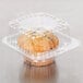 A close up of a muffin in a Polar Pak clear plastic container.