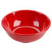 A red melamine salad bowl with a white interior.