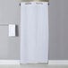 A white Hookless stall size shower curtain hanging in a bathroom.