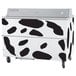 A white and black Beverage-Air milk cooler with black cow spot decals on the front.