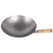 A Town Mandarin carbon steel wok with a wood handle.