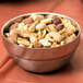 An American Metalcraft double wall stainless steel bowl filled with mixed nuts.