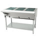 A large stainless steel Eagle Group open well hot food table with three pans.