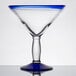 A clear Libbey martini glass with a blue rim and base.