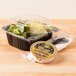 A salad in a Polar Pak clear hinged plastic take-out container.