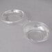 Two Polar Pak clear plastic bowls with lids.