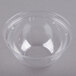 A clear plastic bowl with a Dart clear plastic dome lid with a hole in it.