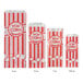 A row of red and white striped Carnival King popcorn bags.